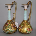 A pair of Copeland gilt and floral decanted ewer style vases