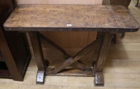 An iron bound oak 'shove halfpenny' table, W.100cm