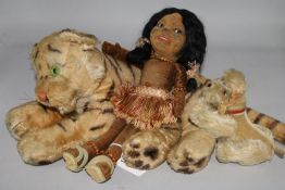 A Steiff tiger, a Steiff dog and a doll