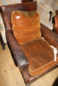A 1930's French brown leather armchair