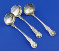 Three 19th century Scottish silver King's pattern sauce ladles, with engraved initial, pair by