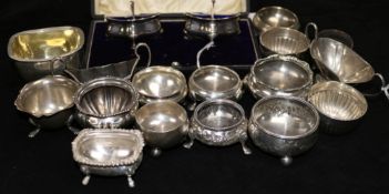 A cased pair of shaped silver salts, with blue glass liners and a quantity of other silver salts,