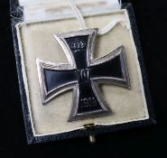 First Class iron cross in box and a German 2nd World War arm badge
