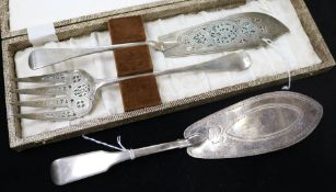 A George III silver fish slice, London 1802 and a pair of Victorian silver fish servers, cased