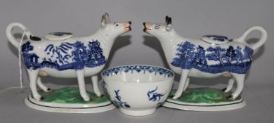 A pair of Staffordshire Willow pattern cow creamers and a Worcester blue and white tea bowl