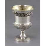A George IV silver vase shaped pedestal goblet, with applied vineous band and embossed with