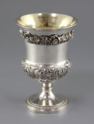 A George IV silver vase shaped pedestal goblet, with applied vineous band and embossed with