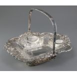 A Victorian pierced and embossed silver shaped rectangular fruit basket by Atkin Brothers, with