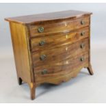 A George III inlaid mahogany serpentine chest, of four graduated long drawers, on swept bracket