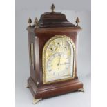 A George III style mahogany eight day chiming bracket clock, the arched dial with strike silent,