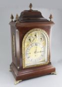 A George III style mahogany eight day chiming bracket clock, the arched dial with strike silent,