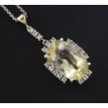 A gold, citrine and gem set oval pendant, on a fine link chain, pendant 1.75in.