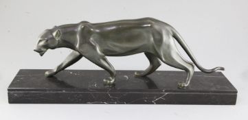 Henri Molins. An Art Deco green patinated bronze model of a prowling panther, on black marble