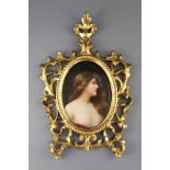 A Berlin KPM oval porcelain plaque, late 19th century, head and shoulder portrait of a young maiden,