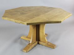 A Robert 'Mouseman' Thompson oak octagonal centre table, with saltire pillar and trestle feet, a