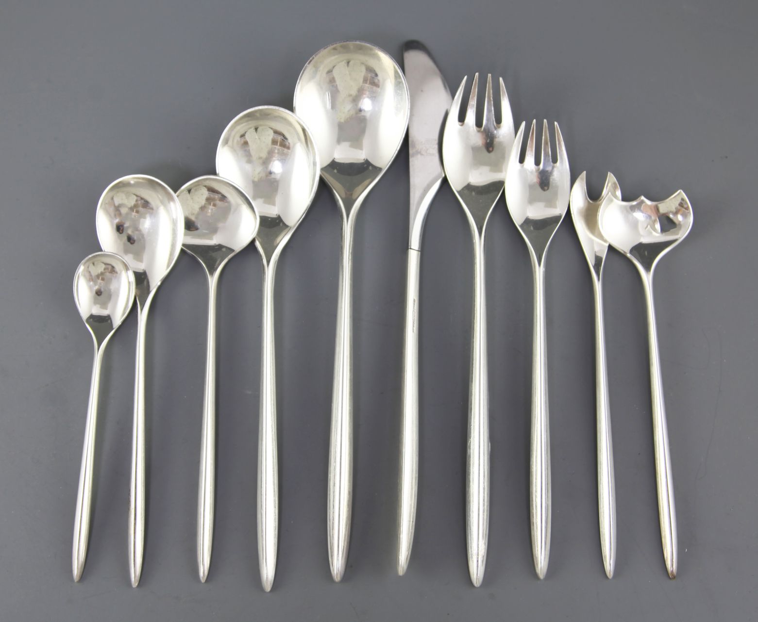 A stylish mid 20th century part suite of Danish sterling silver cutlery by Cohr, comprising