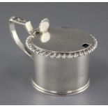 A George IV silver drum mustard by Emes & Barnard, with gadrooned border, shell thumbpiece and