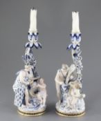 A pair of Meissen figural candlesticks, late 19th century, each modelled with a cherub and a