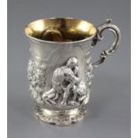 A Victorian silver christening mug embossed with a child and seated dog, James Charles Edington,