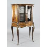 A Victorian marquetry inlaid rosewood and satinwood display cabinet, with serpentine front and