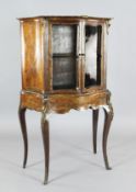 A Victorian marquetry inlaid rosewood and satinwood display cabinet, with serpentine front and