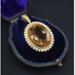 A Victorian gold, citrine and split pearl set oval pendant, in fitted box, 1.5in.