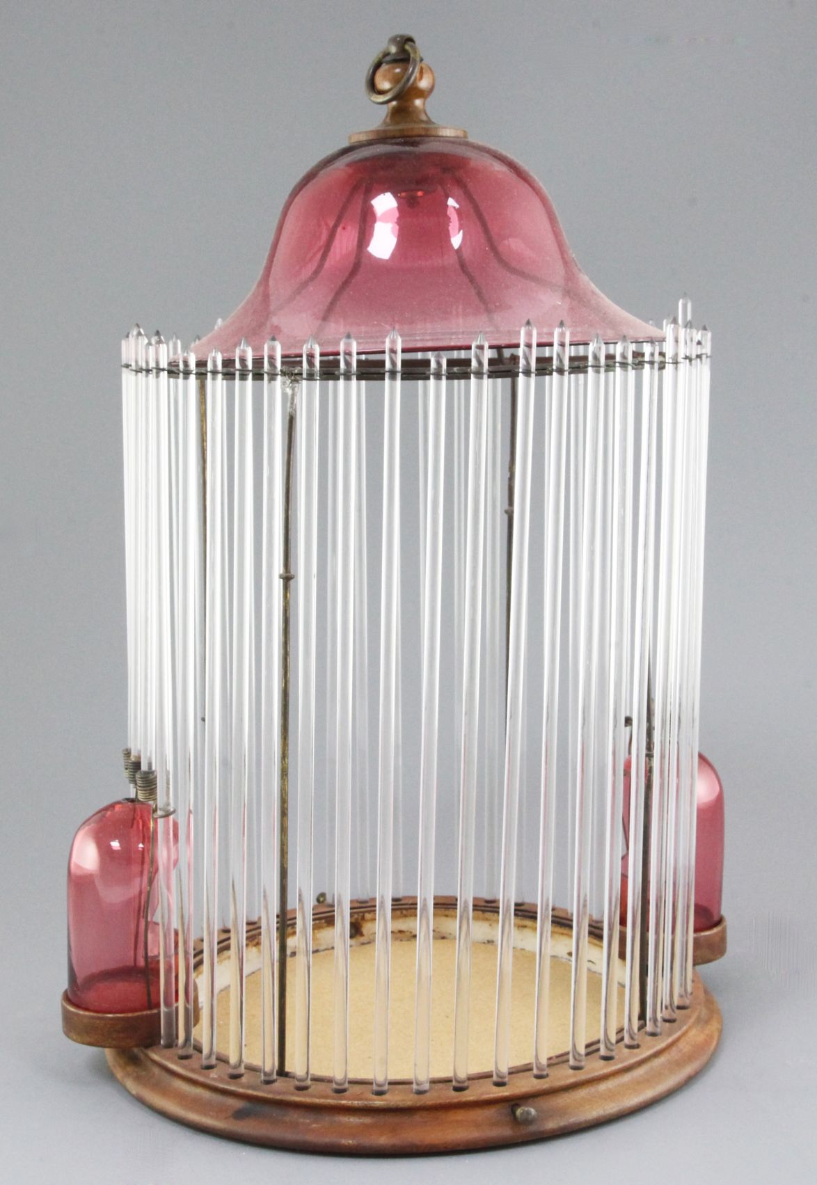 An Italian glass birdcage made from cranberry and clear glass, possibly Murano circa 1910, height
