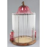An Italian glass birdcage made from cranberry and clear glass, possibly Murano circa 1910, height