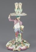 A Chelsea 'gardener' candlestick figure, c.1760-5, the figure holding a spade in his left hand and