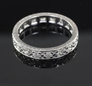 A platinum and diamond full eternity ring, set with eighteen round cut stones, size M.