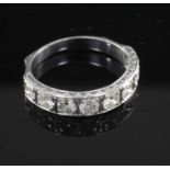 An 18ct white gold and diamond half eternity ring, set with eight round cut stones, size L.