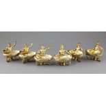 A handsome set of six 19th century continental cast silver gilt nautical table salts, three modelled