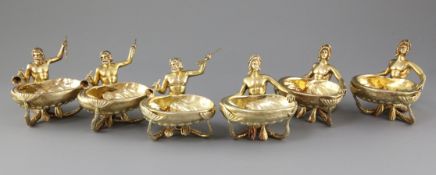 A handsome set of six 19th century continental cast silver gilt nautical table salts, three modelled