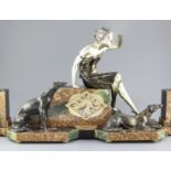 Uriano. An Art Deco bronze spelter and marble clock garniture, modelled with a woman and two borzoi,