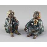 A pair of Franz Bergman cold painted bronze figures of seated Arab children, 2.75in.