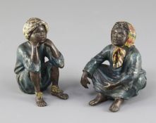 A pair of Franz Bergman cold painted bronze figures of seated Arab children, 2.75in.