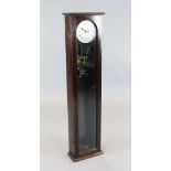 An early 20th century mahogany cased Synchronome Electric wall clock with visible pendulum, 1ft. H.