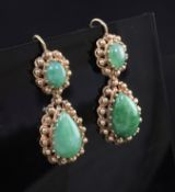 A pair of gold and jade drop earrings, each set with two cabochon stones and beaded gold border,