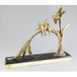 Michel Decoux. An Art Deco gilt bronze group of four birds perched upon a branch, on marble