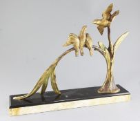 Michel Decoux. An Art Deco gilt bronze group of four birds perched upon a branch, on marble