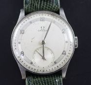 A gentleman's late 1930's steel Omega manual wind wrist watch, with Arabic and dot numerals and