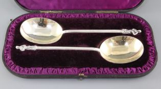 A cased pair of Victorian silver apostle spoons, with hexagonal stems and gilded bowls, Edward