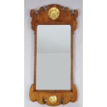 An early 18th century walnut fret frame wall mirror, with parcel gilt scallop motifs, W.2ft 4in. H.