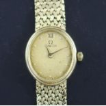 A lady's early 1980's 9ct gold Omega quartz wrist watch, on integral 9ct gold Omega bracelet.