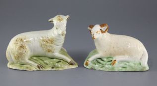 A Staffordshire creamware figure of a recumbent ram and a similar pearlware figure of a recumbent