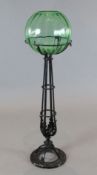 A Victorian uranium glass fish bowl on black painted wrought iron stand, H.43in.