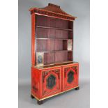 A Chinese Chippendale style red lacquered bookcase, with pagoda pediment, open shelves and