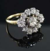 A Victorian gold, silver and diamond cluster ring, set with eleven old mine cut stones, size P.