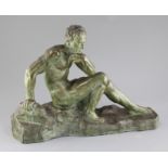 A. Ouline. An Art Deco bronzed terracotta figure of a seated man, on integral naturalistic base,