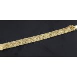 An early 1970's 18ct gold bracelet, with chevron style decoration, 7.25in.